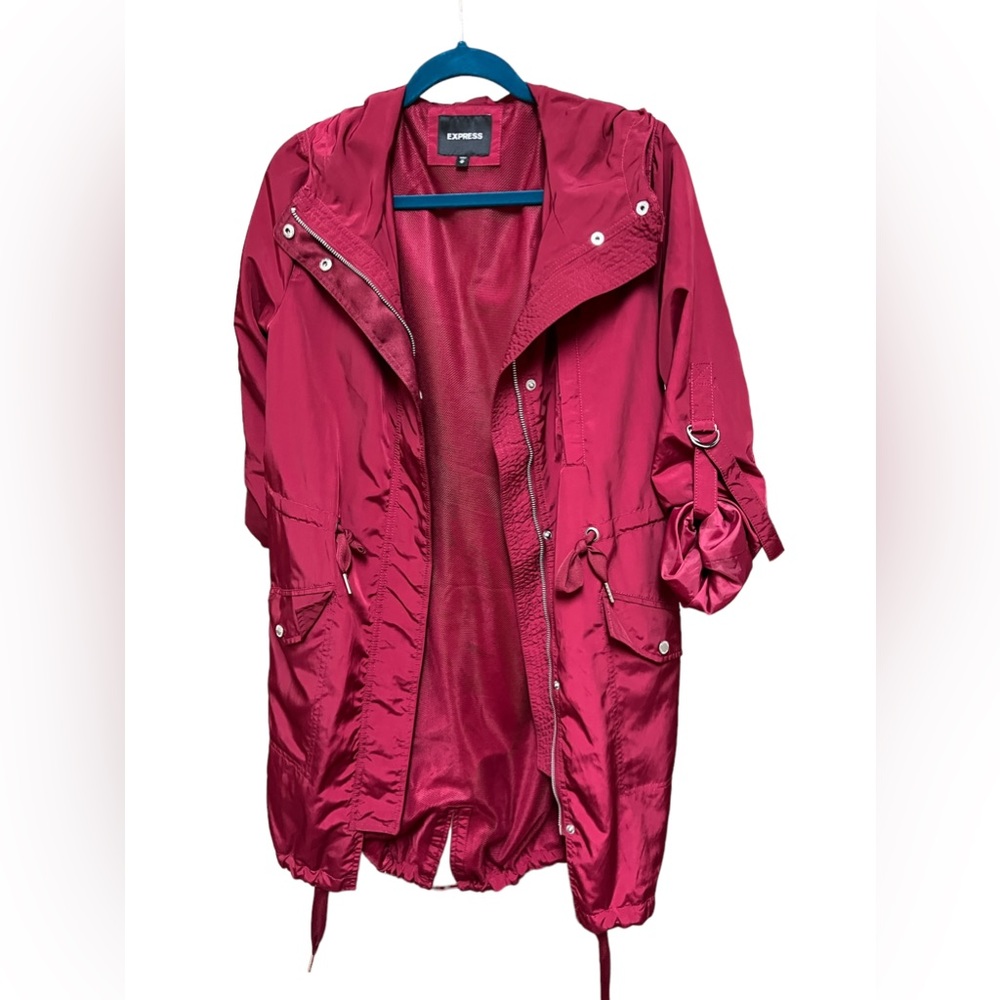 Red raincoat with adjustable waist and bottom.